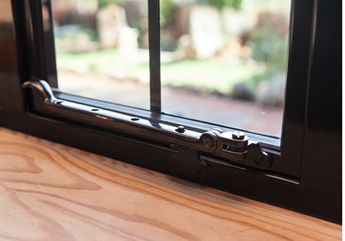 Traditional pegstay fitted to a steel-style window