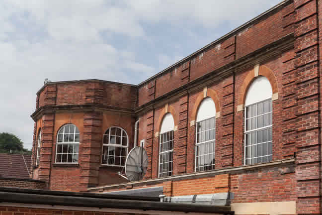Traditional metal-frame windows preserving the character of Haslemere Hall