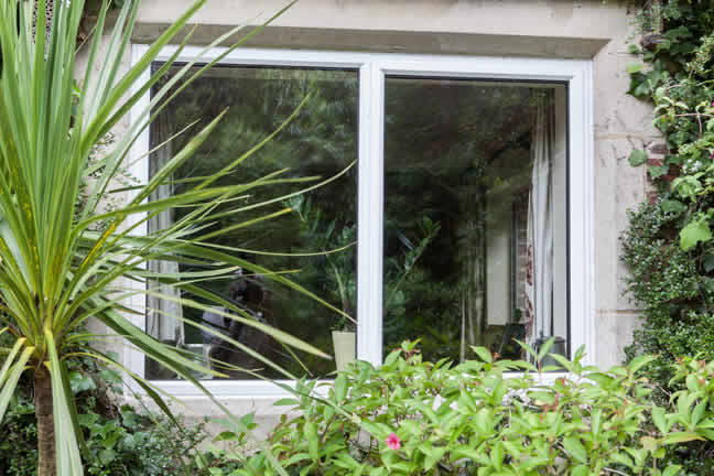 Steel-style replacement windows viewed from outside the property